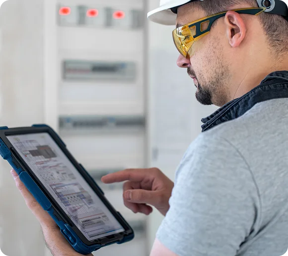 Certified electrical testing technician holding test equipment
