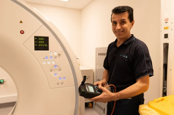 Technician testing and tagging an electrical appliance in a Perth workplace